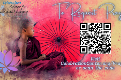 Young monk with red umbrella, peaceful and contemplative.