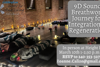 People meditating in a candlelit room.