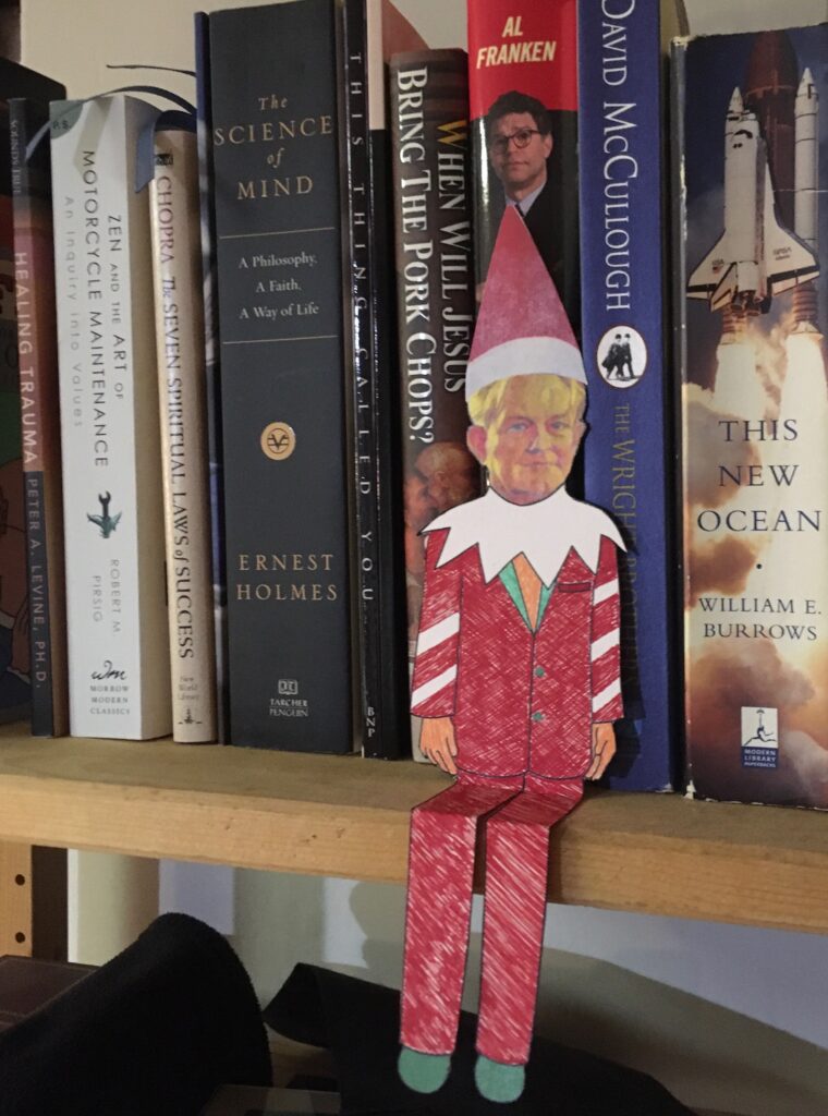 paper doll with elf and books