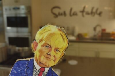 paper doll in front of sur la table restaurant