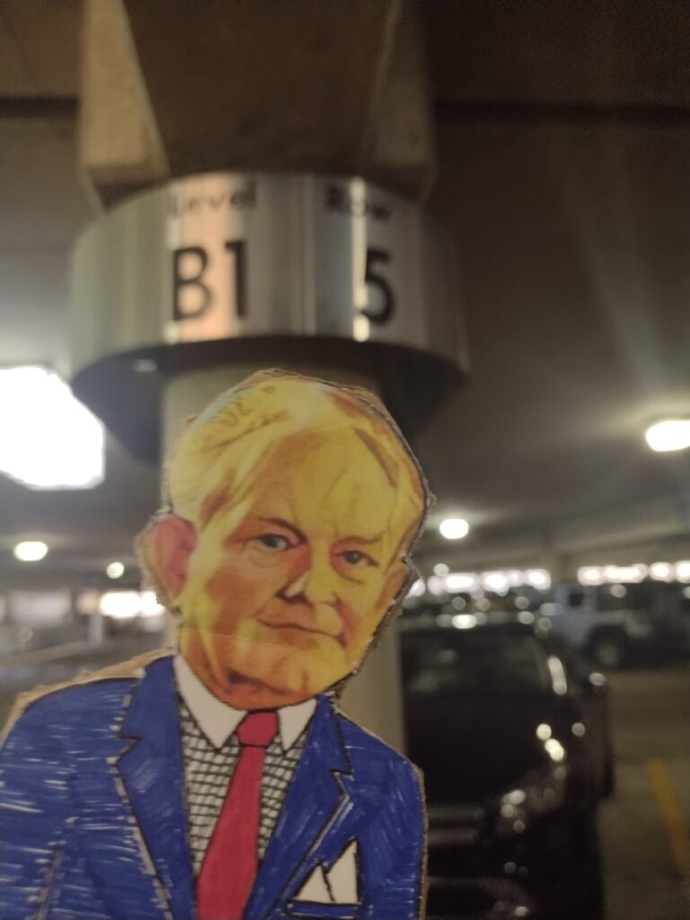 paper doll in a basement parking