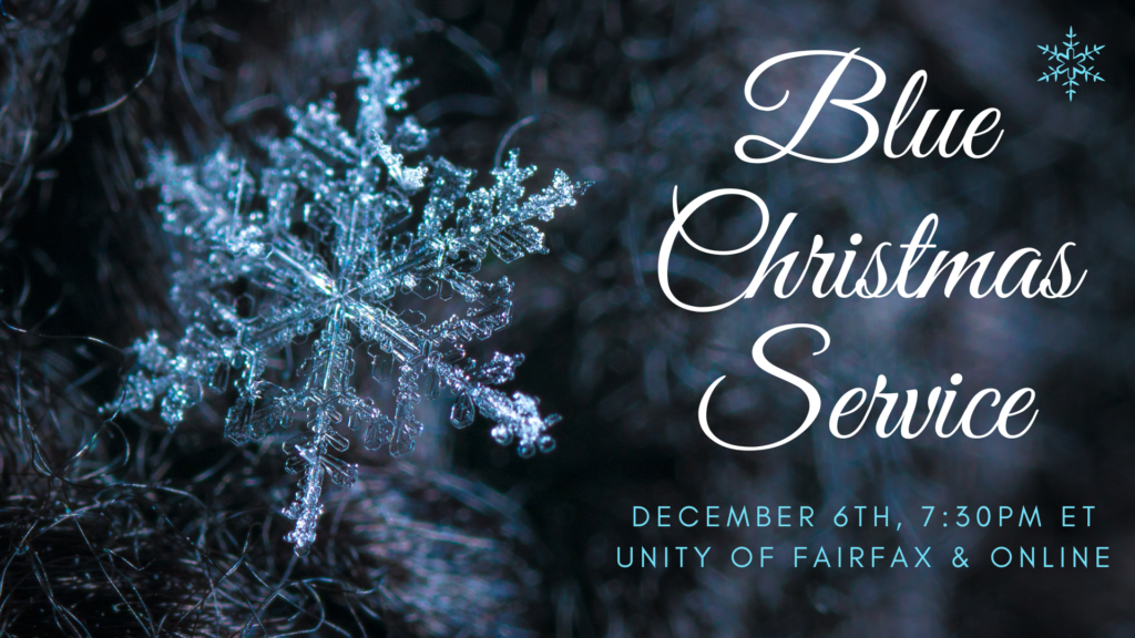 Close-up of a detailed snowflake on a dark background with Christmas text.