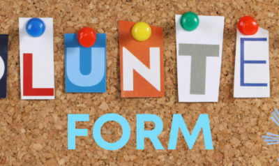 Volunteer form on corkboard background.
