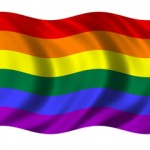 Waving rainbow flag with vibrant colors.